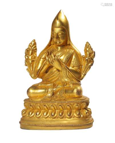 A GILT--BRONZE FIGURE OF GURU.QING PERIOD