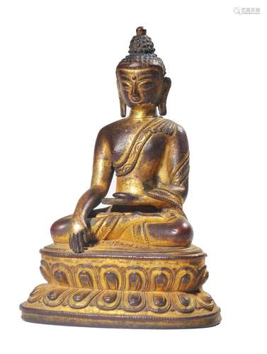 A GILT-BRONZE FIGURE OF SAKYAMUNI.MING PERIOD