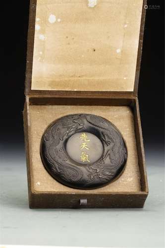 A CHINESE ROUND INKSTONE