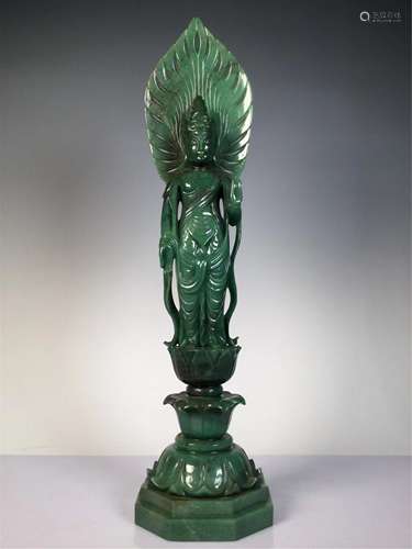 A JADE CARVED STANDING BUDDHA STATUETTE