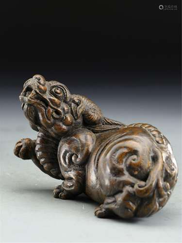 A CHINESE AGARWOOD FOO-DOG ORNAMENTS