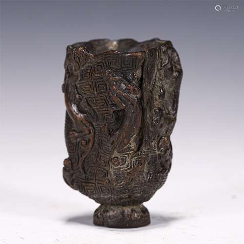 A CHINESE CARVED DRAGON PATTERN AGARWOOD CUP