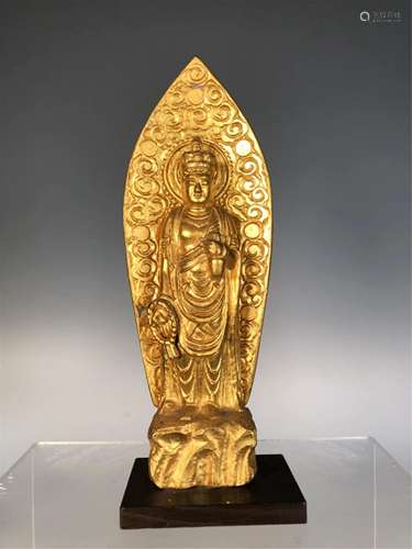 A GILDING STANDING BUDDHA STATUETTE