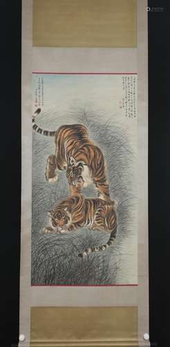 A SCROLL PAINTING OF TWO TIGERS