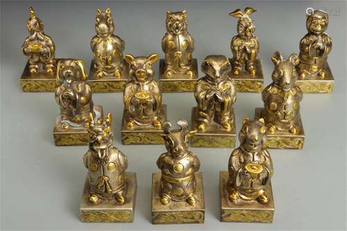 TWELVE CHINESE WHITE GILT BRONZE TWELVE ANIMALS SEALS