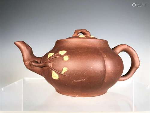 A YIXING CLAY INCISED FLORAL TEA POT