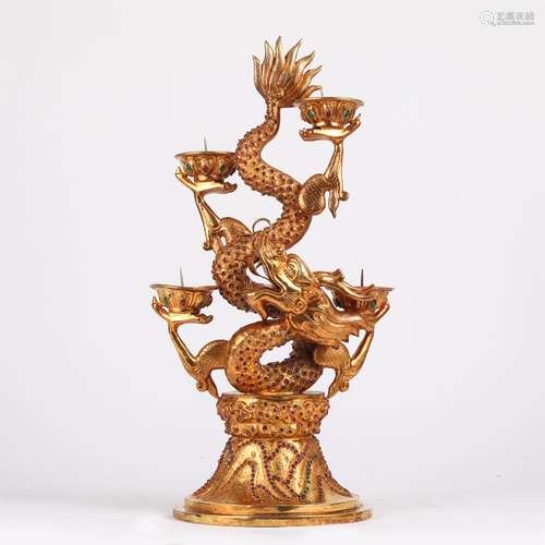 A CHINESE GILT BRONZE DRAGON SHAPE CANDLE HOLDER