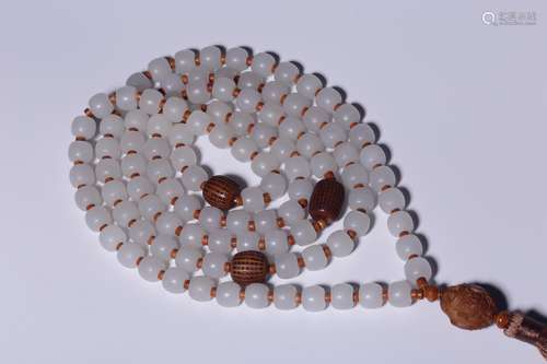 A CHINESE WHITE JADE HAND HELD ROSARY