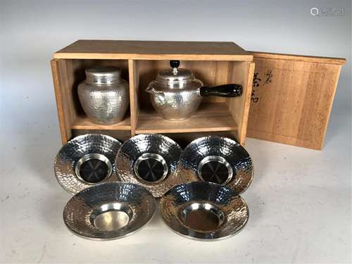 A SET OF TIN MADE TEA WARES