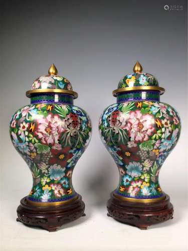 PAIR OF GREEN GROUND CLOISONNE JARS AND COVERS