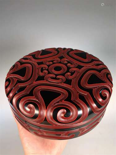 A CARVED LACQUER CIRCULAR BOX AND COVER