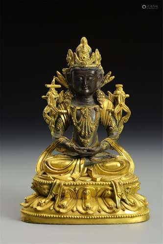 A CHINESE GILT BRONZE FIGURE OF BUDDHA SEATED STATUE