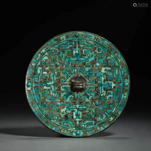 BRONZE MIRROR INLAID WITH TURQUOISE AND STONE, THE WARRING S...