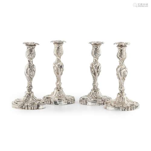 A SUITE OF FOUR GEORGE III TABLE CANDLESTICKS AND A