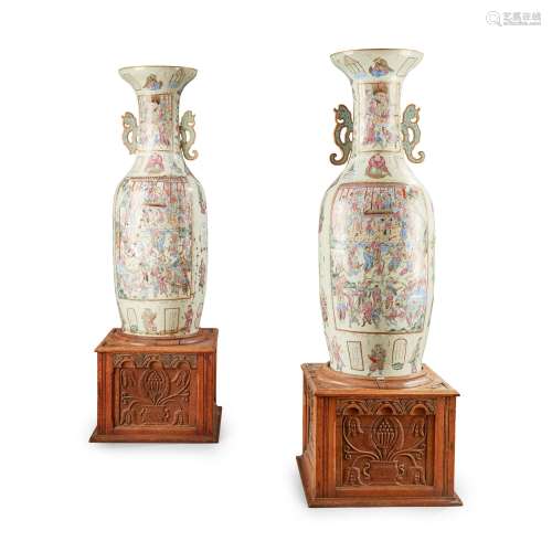 A PAIR OF MONUMENTAL CANTONESE FAMILLE ROSE PORCEL…