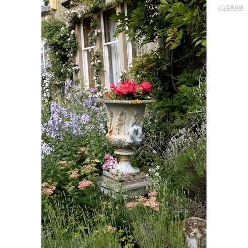 A PAIR OF CAST IRON GARDEN URNS 19TH CENTURY