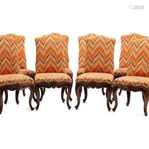 A Set of Eight Continental Carved Walnut Dining Chairs