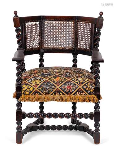 A Jacobean Style Carved Oak Cane Back Armchair Height