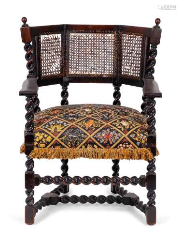 A Jacobean Style Carved Oak Cane Back Armchair Height