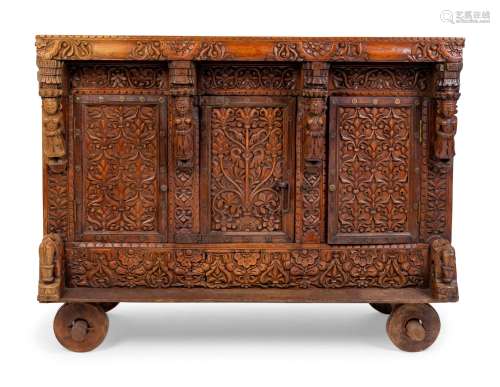An Indian Carved Wood Traveling Trunk on Wheels