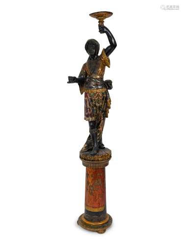 An Italian Carved and Painted Torchere of a Moor on a