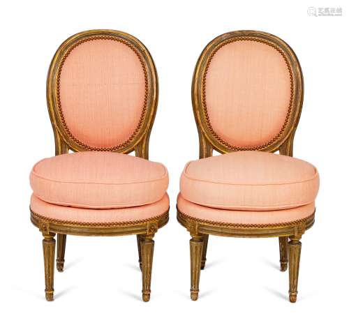A Pair of Louis XVI Parcel-Gilt Petite Boudoir Chairs