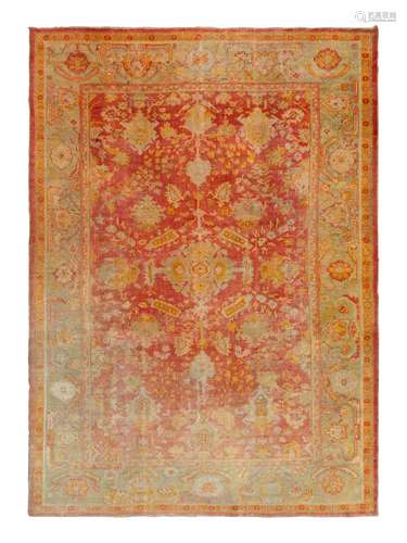 An Oushak Wool Rug 12 feet 6 inches x 9 feet 3 inches.