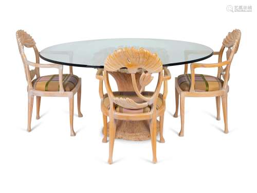 A Hollywood Regency Style Dining Table and Chairs