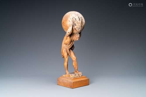 Une statue d'Atlas portant le globe céleste sur ses épaules ...