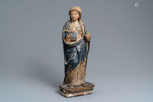 Une statue de Sainte Apolline d'Alexandrie en pierre calcair...