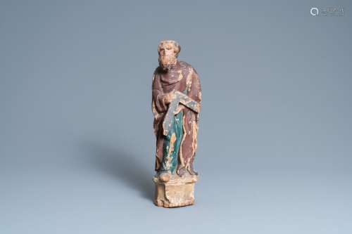 Une statue de Saint Thomas en chêne sculpté et polychromé su...