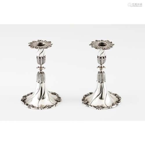 A pair of small apron candlesticks