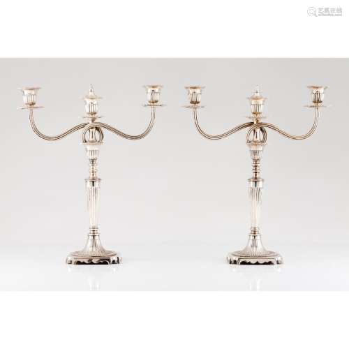 A pair of three branch neoclassical candelabra