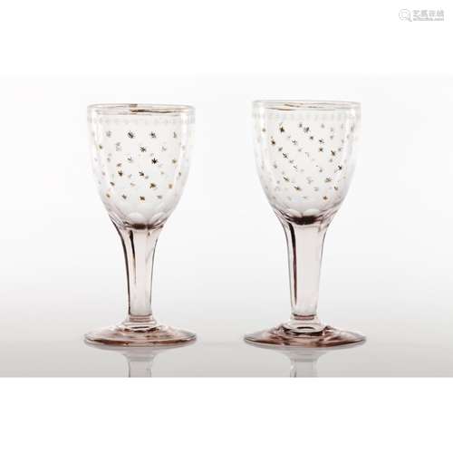 A pair of footed drinking glasses