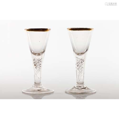 A pair of footed drinking glasses