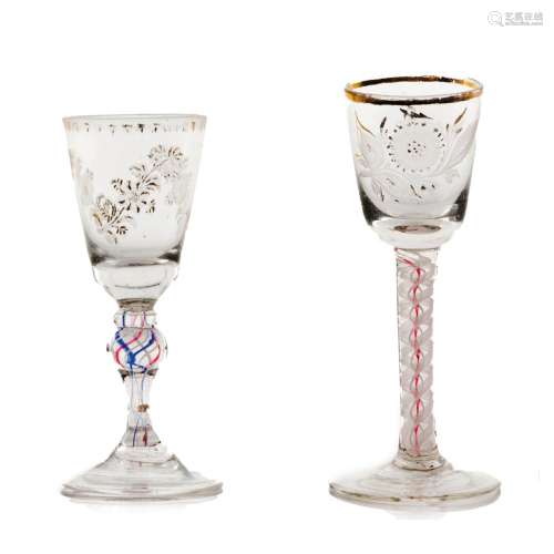 A set of two tall footed glasses