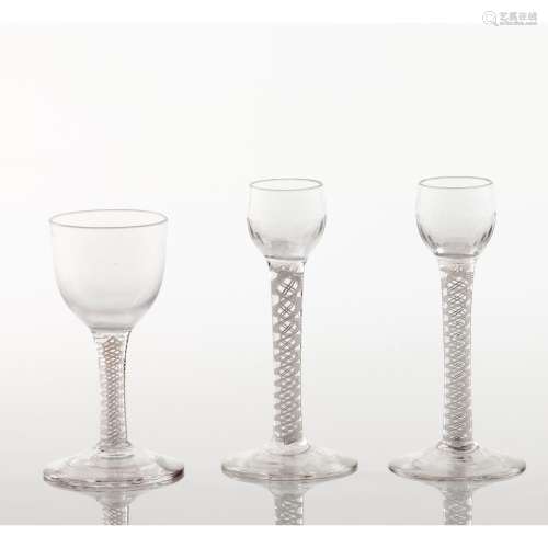 A set of four footed drinking glasses