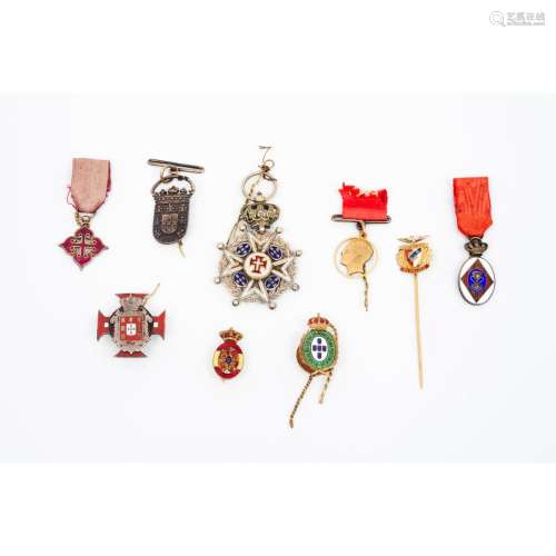 A group of nine medals and insignias
