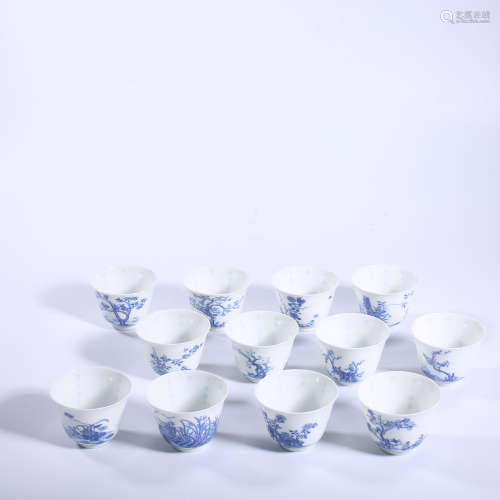 A pair of blue and white twelve flower cups in Kangxi of Qin...
