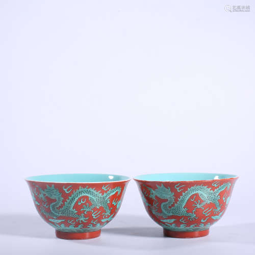 A pair of green dragon bowl with red background in Kangxi of...