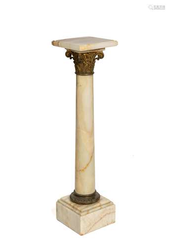 A marble pedestal with bronze mounts