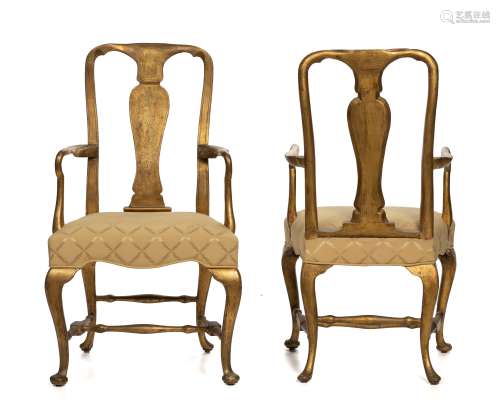 A pair of Queen Anne carved giltwood armchairs