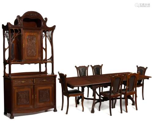 An Art Nouveau carved wood dining set