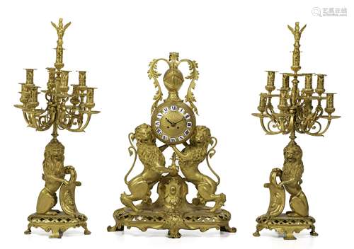 A French gilt-bronze mantel clock and candelabra set