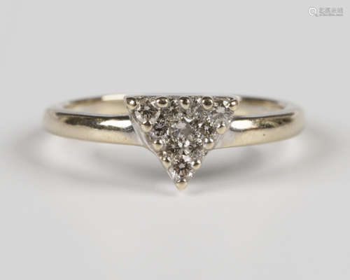 An 18ct gold and diamond triangular cluster ring, mounted wi...