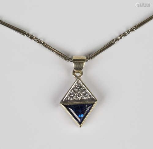 A sapphire and diamond pendant of lozenge form, set with thr...