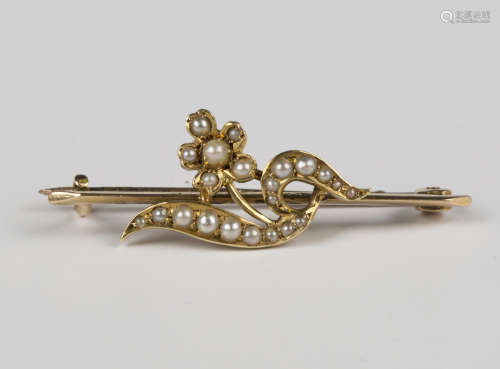 An Edwardian gold and seed pearl brooch, designed as a flora...