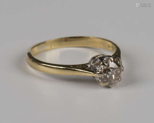 An 18ct gold ring, claw set with a circular cut diamond, Lon...
