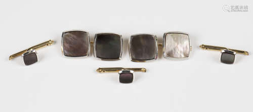 A pair of gold and abalone shell curved square cufflinks, de...