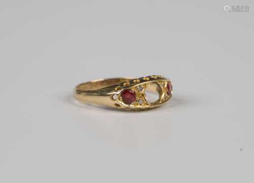 An 18ct gold ring, mounted with a garnet topped doublet and ...